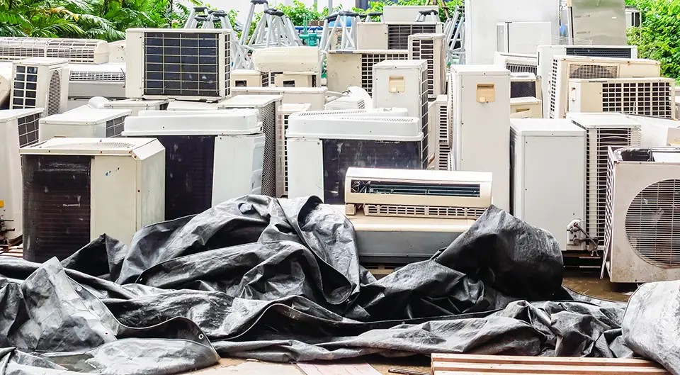 Junk pile of old, broken down air conditioners that did not receive preventive maintenance