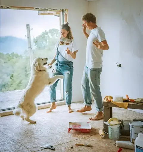 A husband and wife and their dog as they make home renovations.