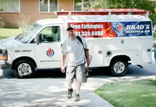 Brad approaches a customer's house for a service call