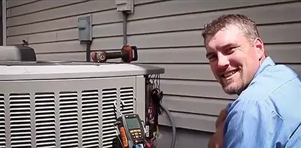 Brad poses for camera while fixing an AC in Jacksonville AR